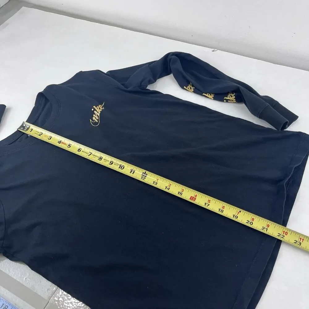 Nike Black long-sleeve t-shirt featuring metallic gold script logos Size Medium